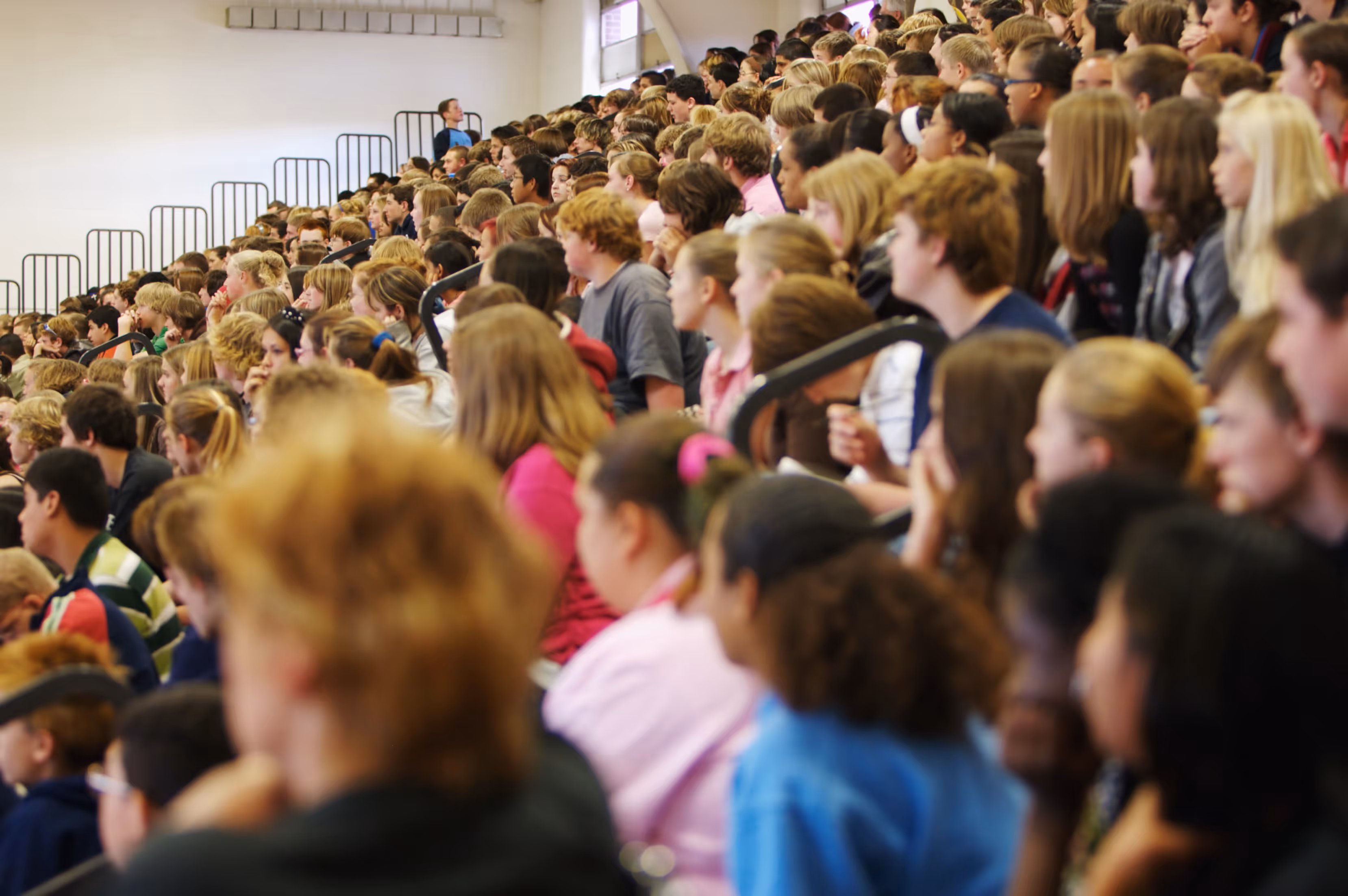 A group of students at a PCW school assembly