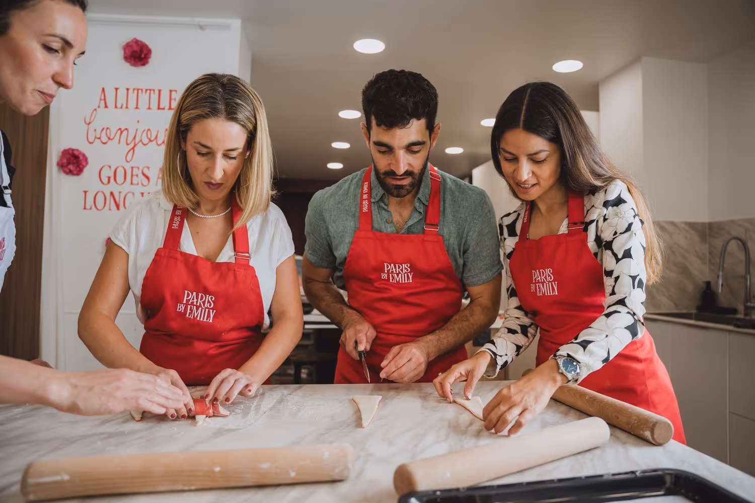 Croissant making three guests cutting the pastry 