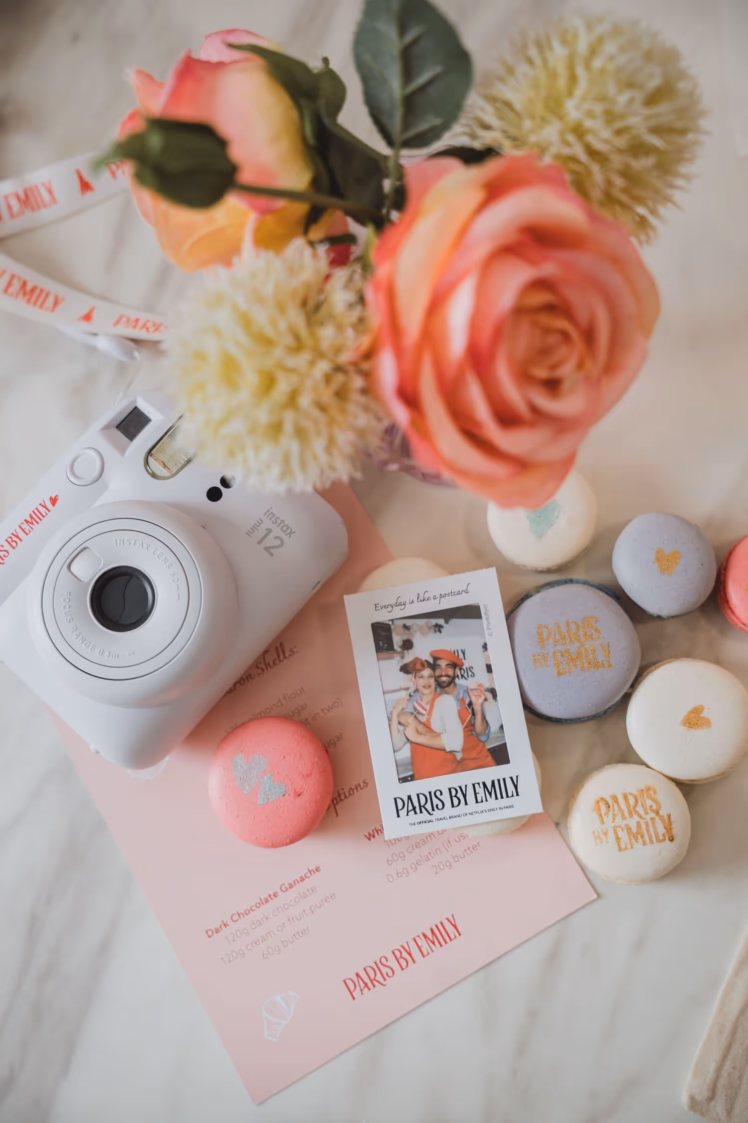 Macaron making table decorations with a polaroid macarons instructions and camera