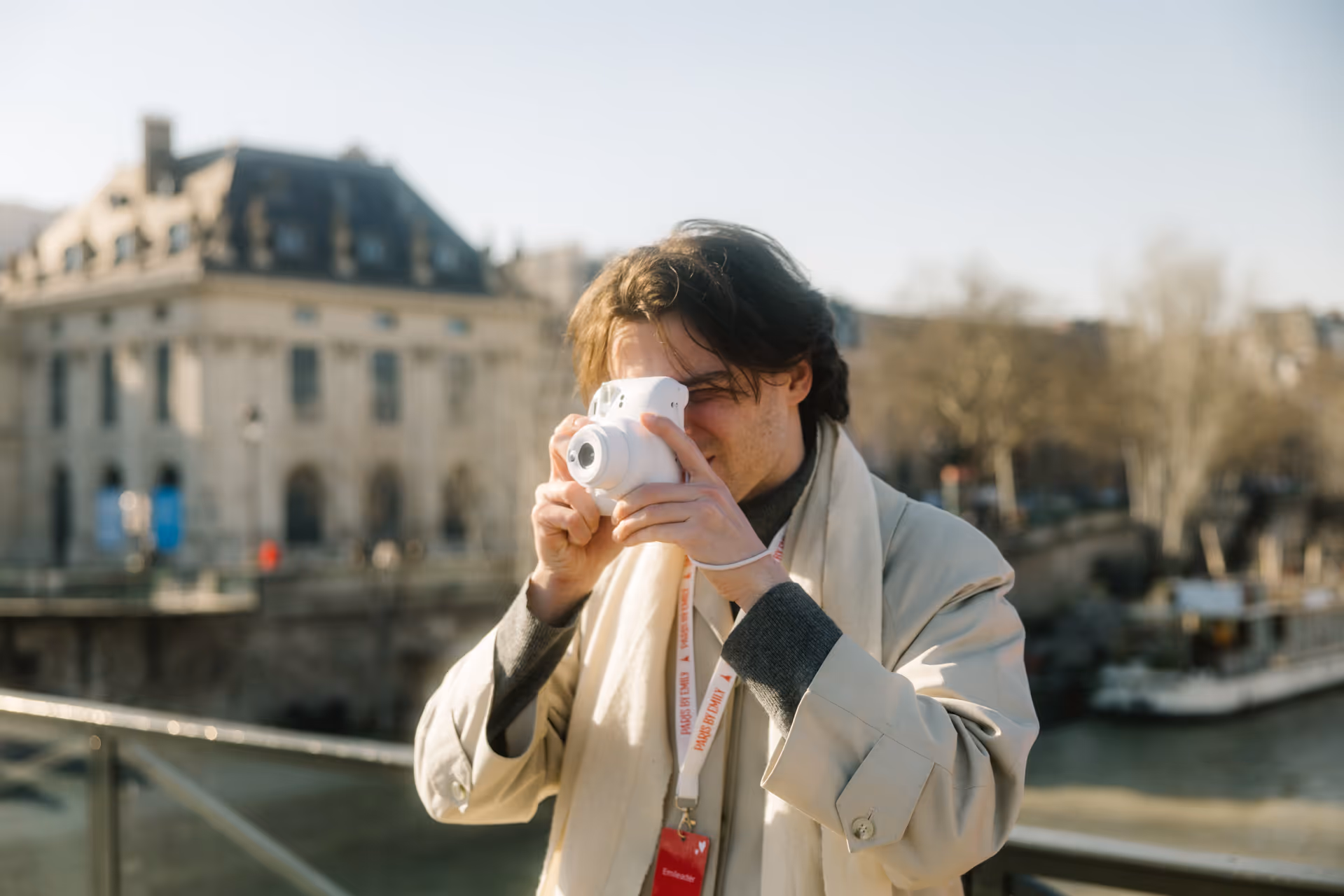 Guide taking a photo of guests on a polaroid photo