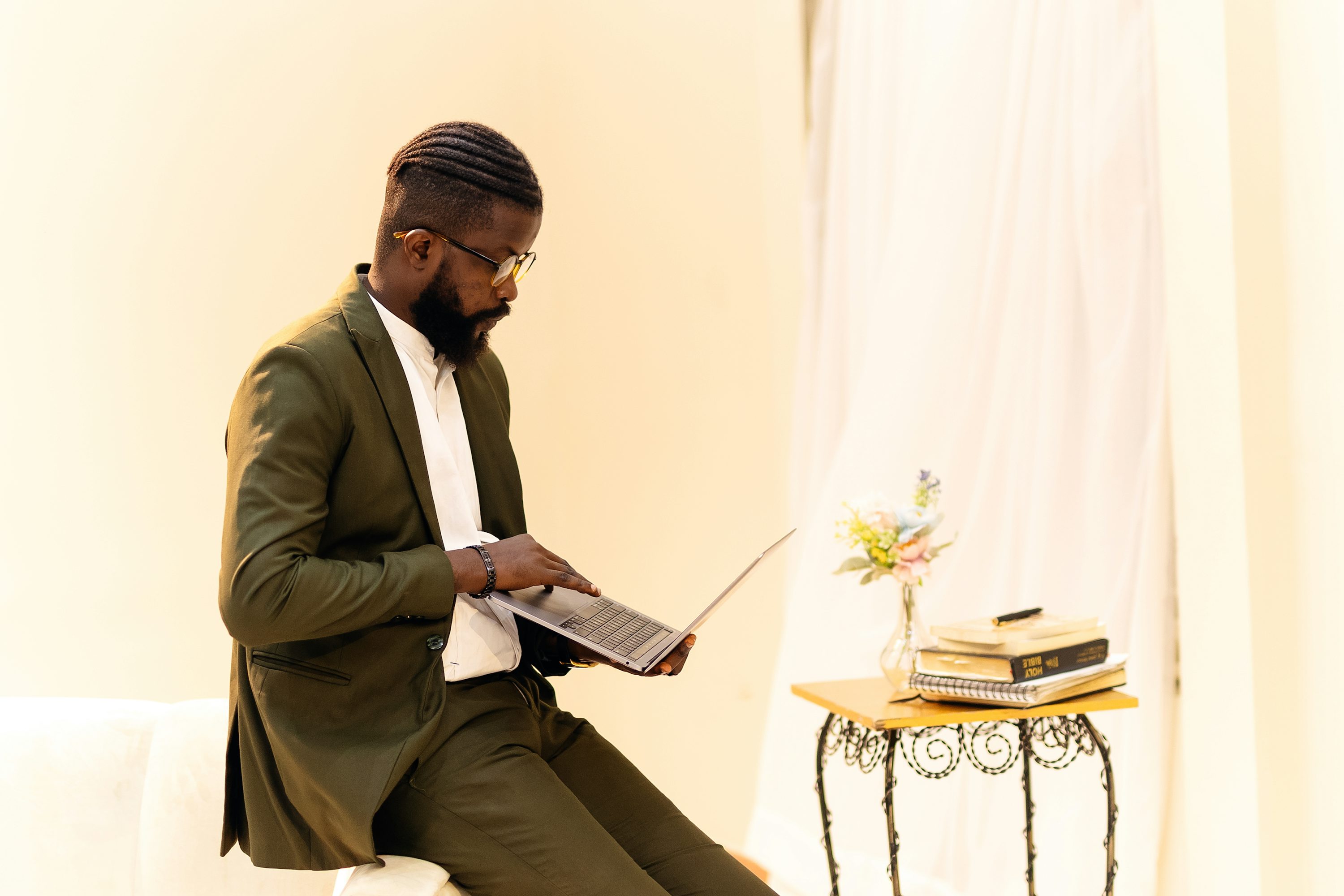 A man sitting on a chair reading a book - Advanced AI Trading