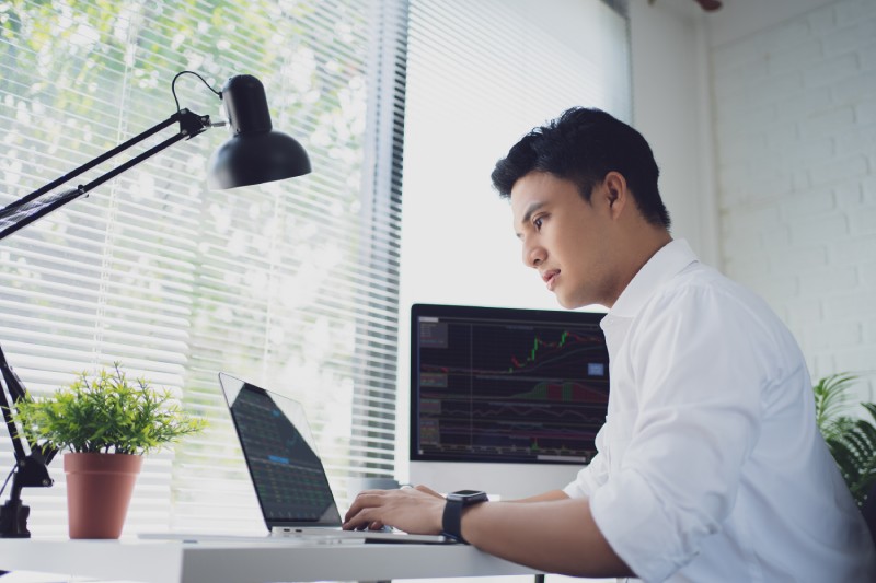 man on a laptop - Automated Futures Trading Strategies