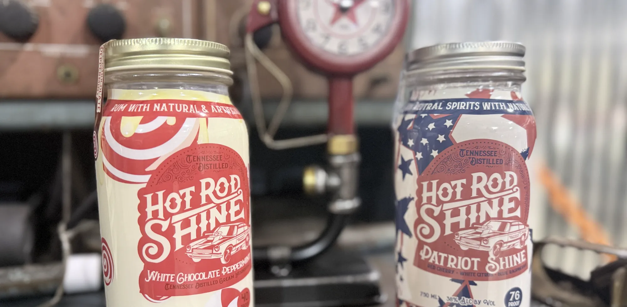 Two Hot Rod Shine jars: white chocolate peppermint and patriotic flavors with vintage car logos.
