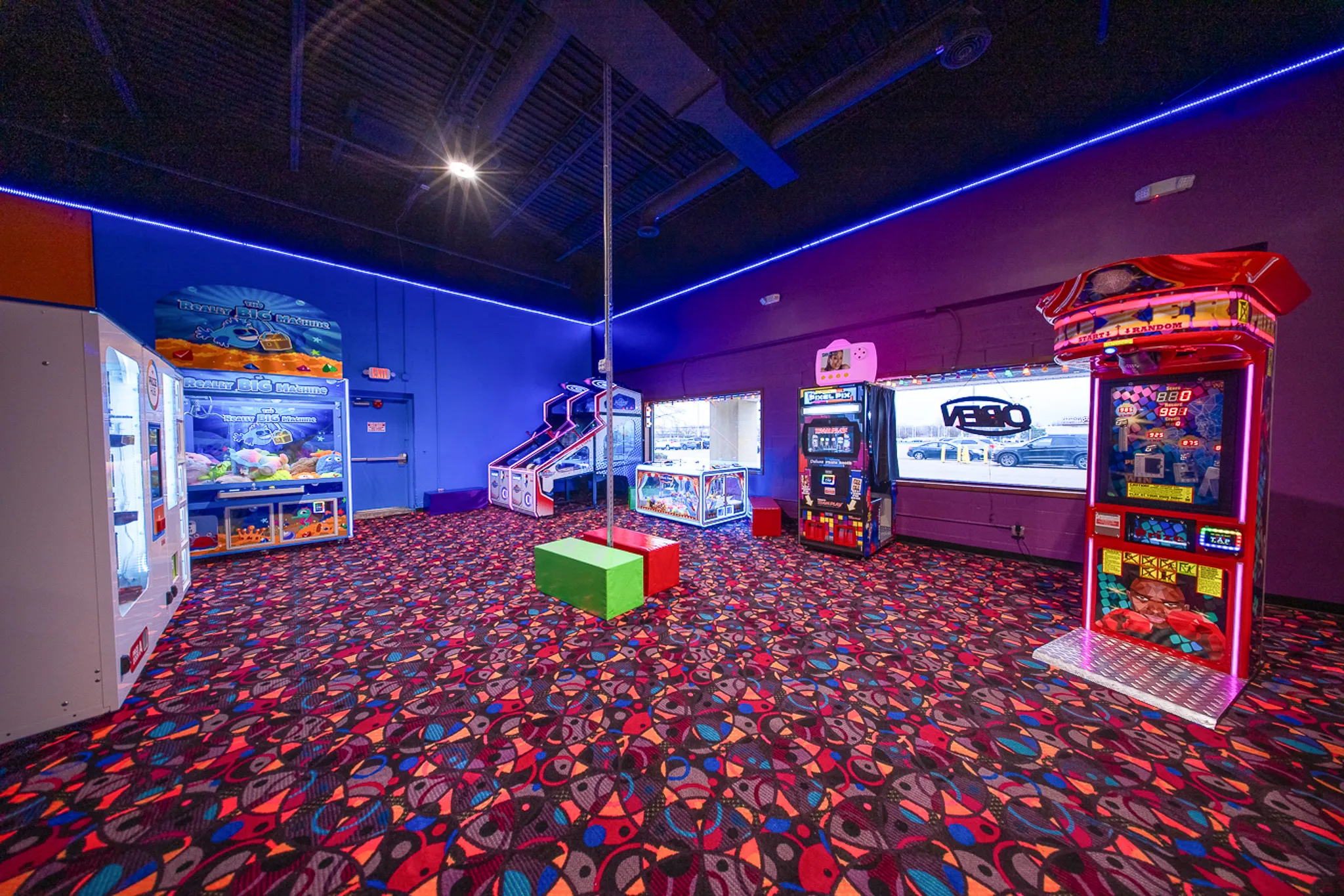 Arcade room with claw machines, prize games and a racing game