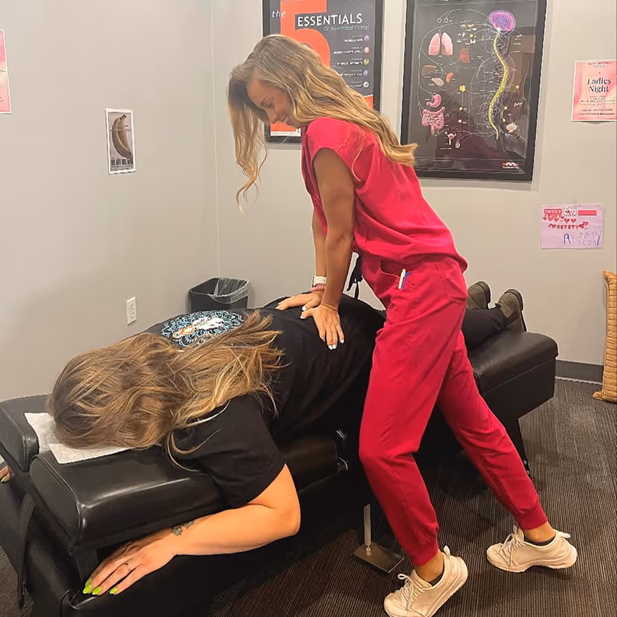 A woman getting a massage from another woman.