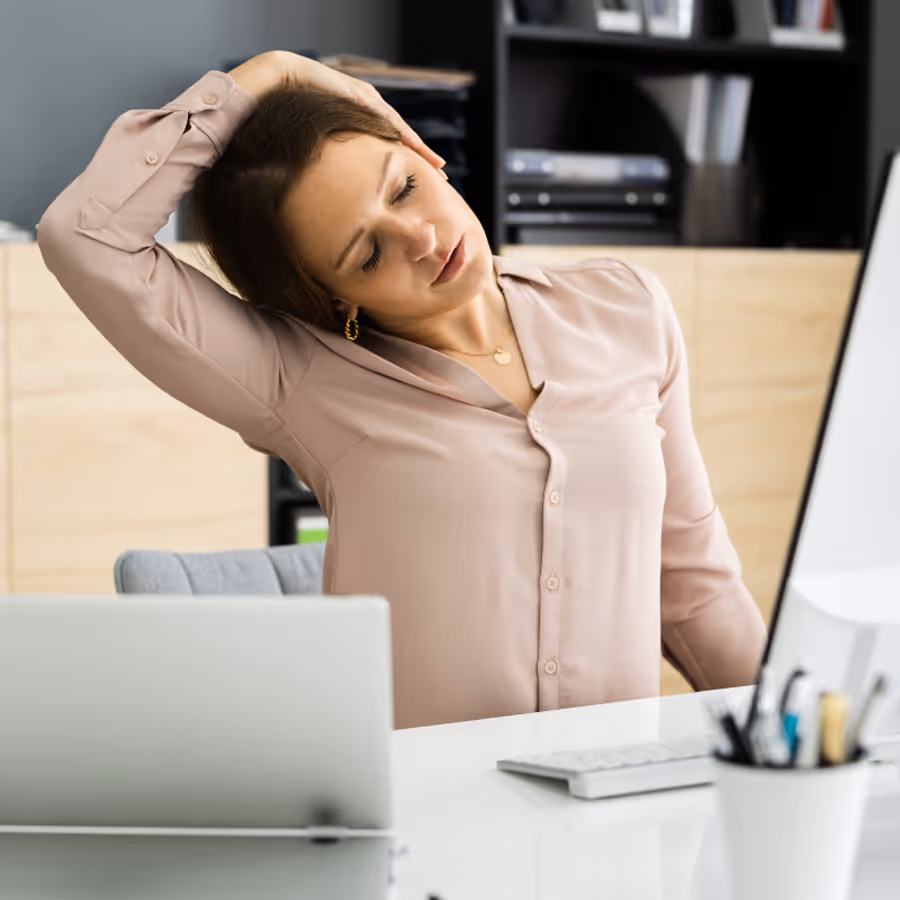 A woman with a laptop on her lap.