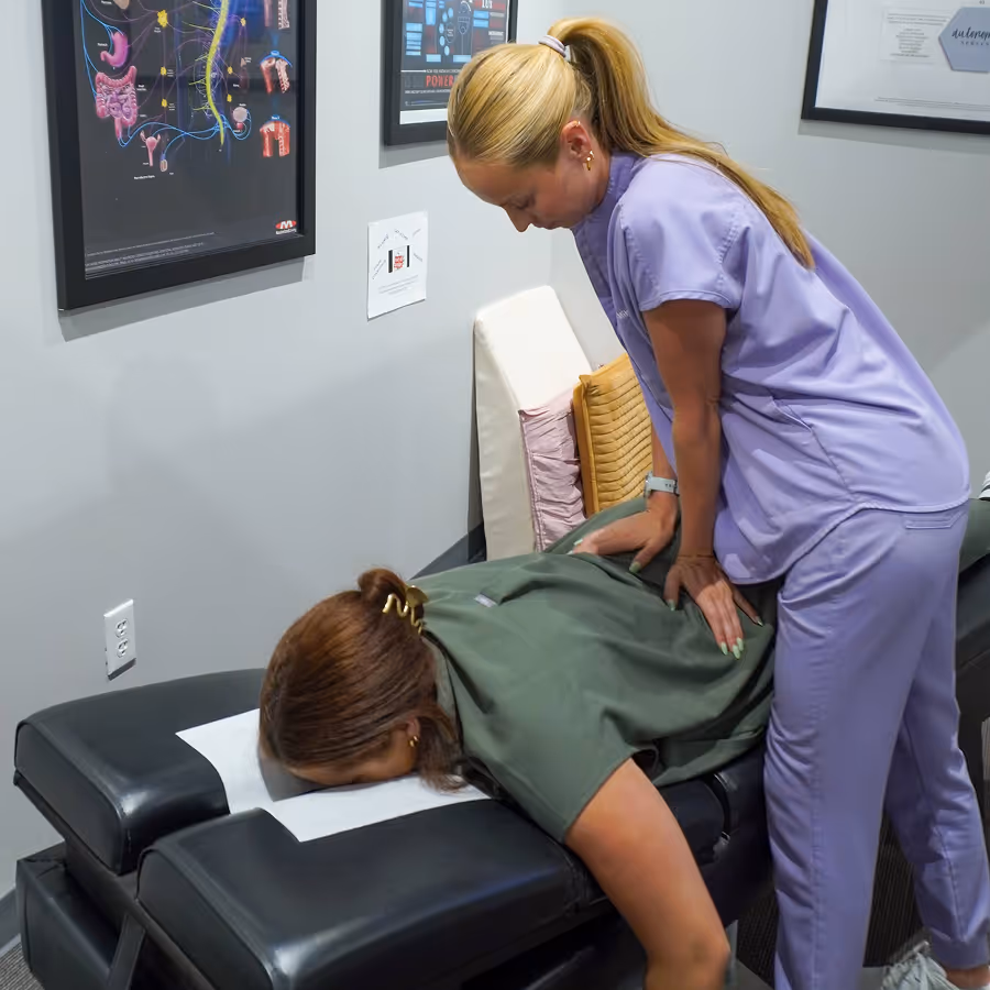 A woman getting a massage from a nurse.