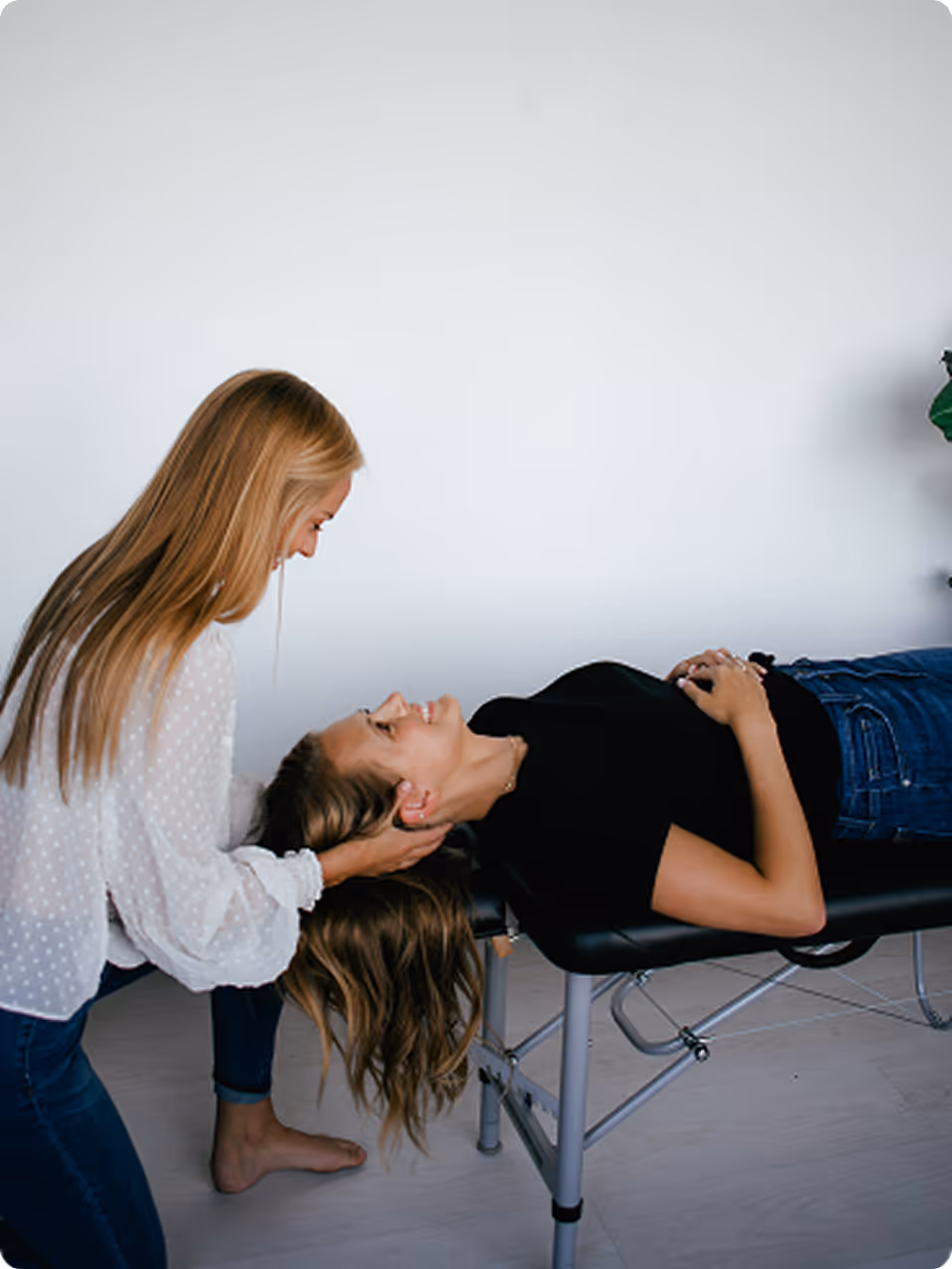A woman with blonde hair getting her hair done.