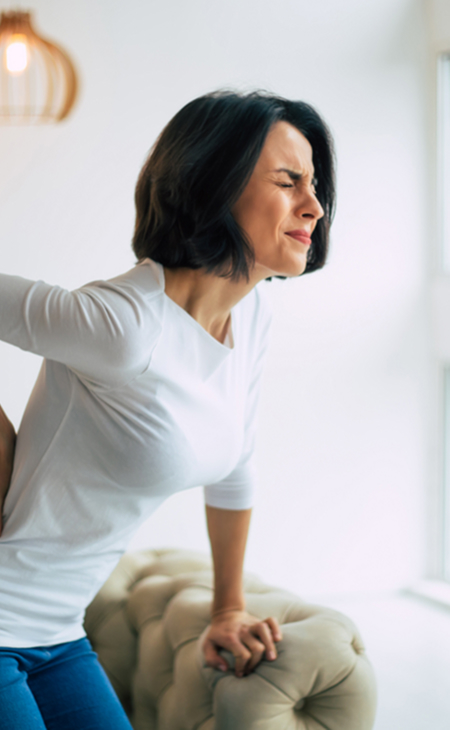 Back pain illustration showing spinal discomfort — Elite Wellness Chiropractic Bee Cave TX