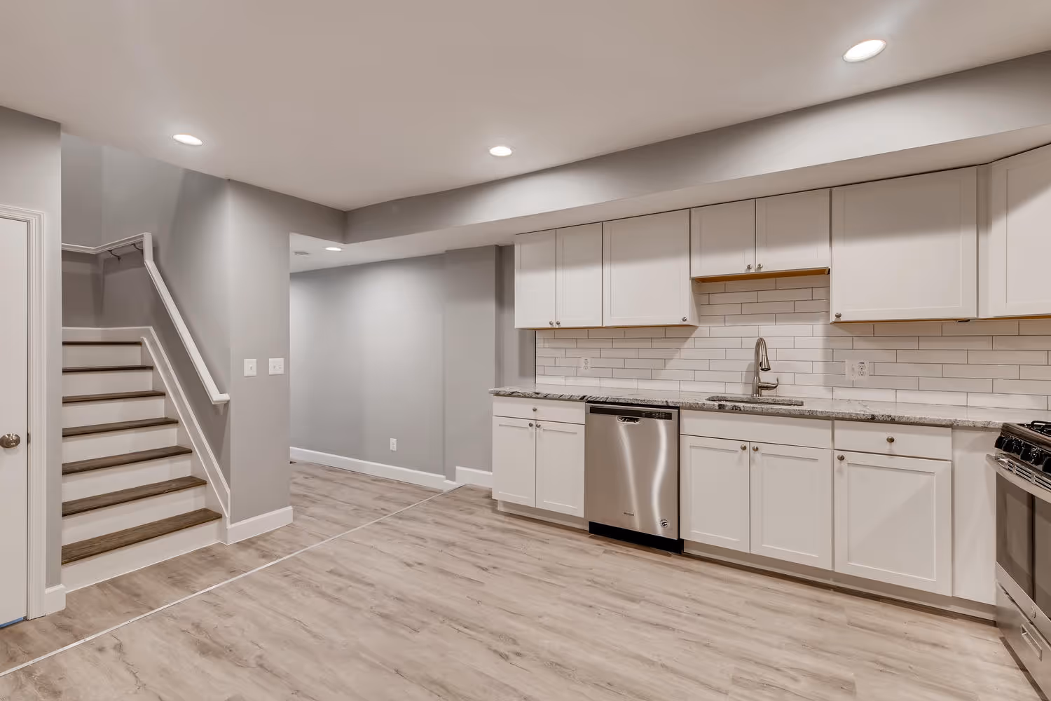 Bright, welcoming spaces built for real life. Modern kitchen and dining space with natural light and hardwood floors.
