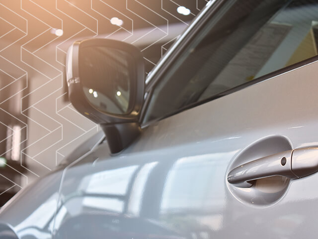 A close up of a cars side view mirror