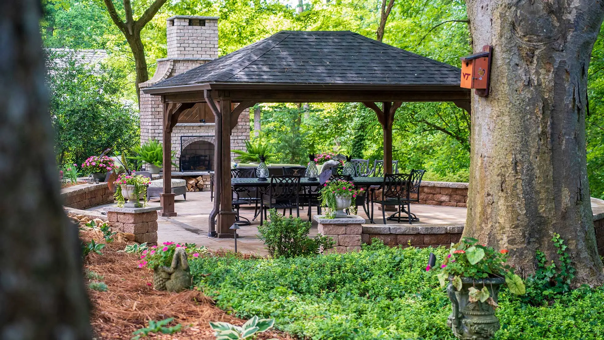 custom patio with pavilion and outdoor fireplace