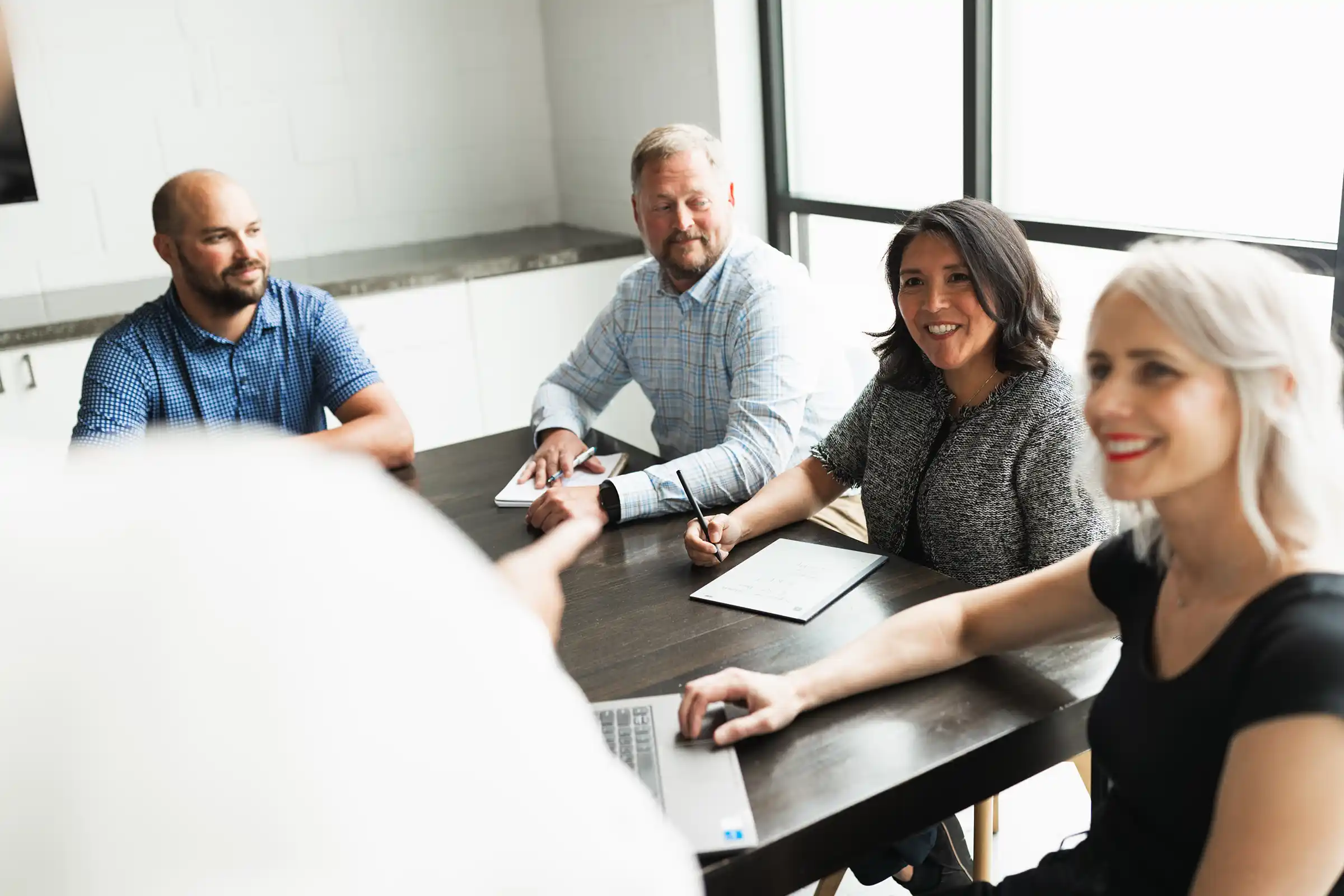 KWT leadership consultants collaborating with executives during an organizational strategy session, helping teams unlock clarity and alignment.
