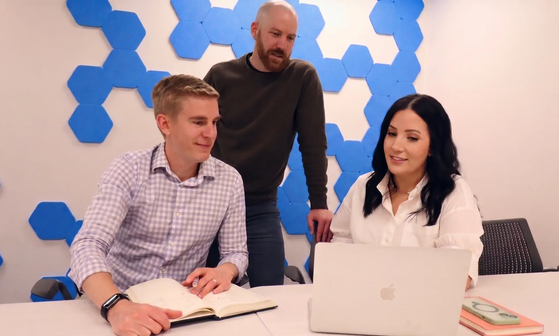 UpRight Growth team reviewing campaign performance together at a laptop