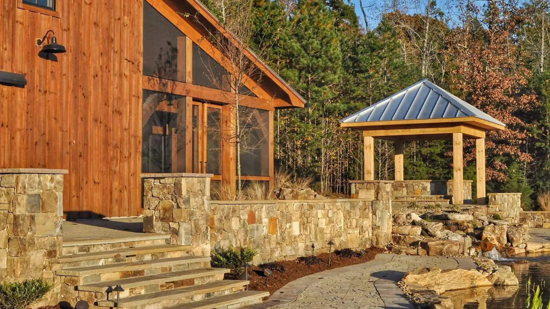 banner retaining seating stone wall by water feature