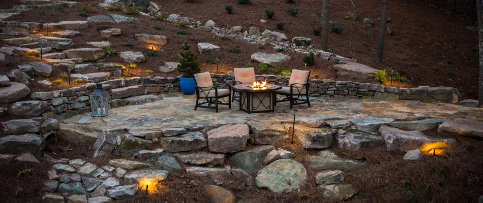 Patio spaced using flat area created from a retaining wall in Greensboro, NC.