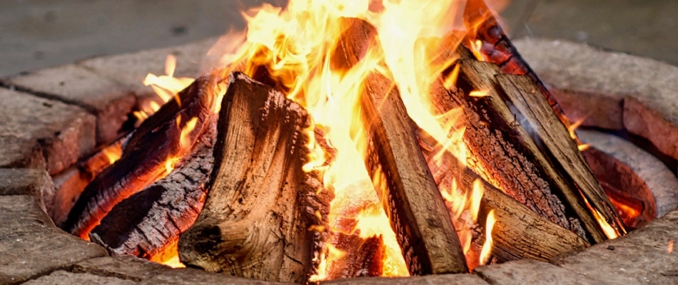 Wood burning in wood fire pit in Greensboro, NC.