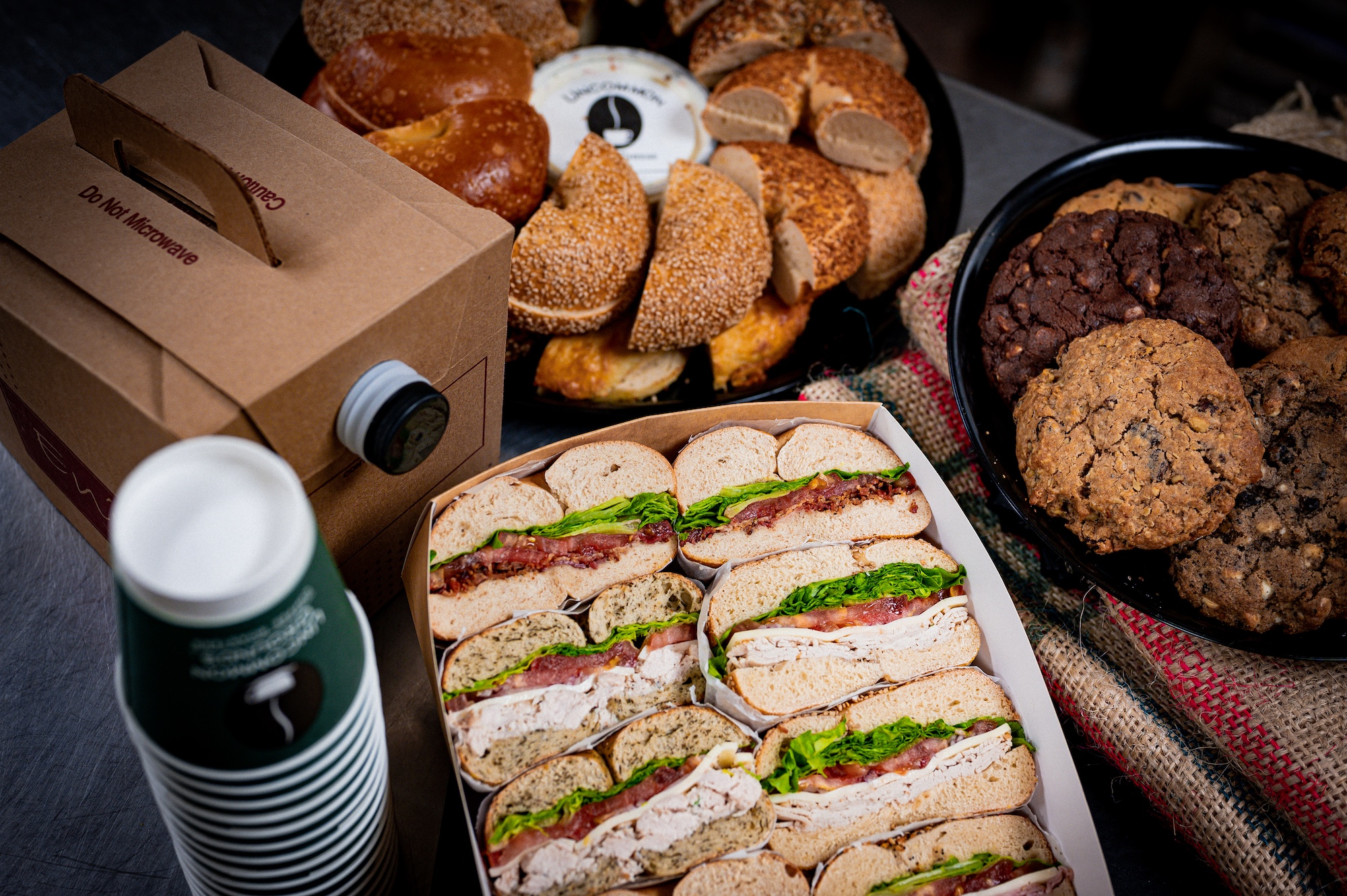 Catering image of bagels, coffee, and cookies.