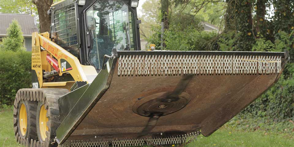 A skid steer bush hog attachment