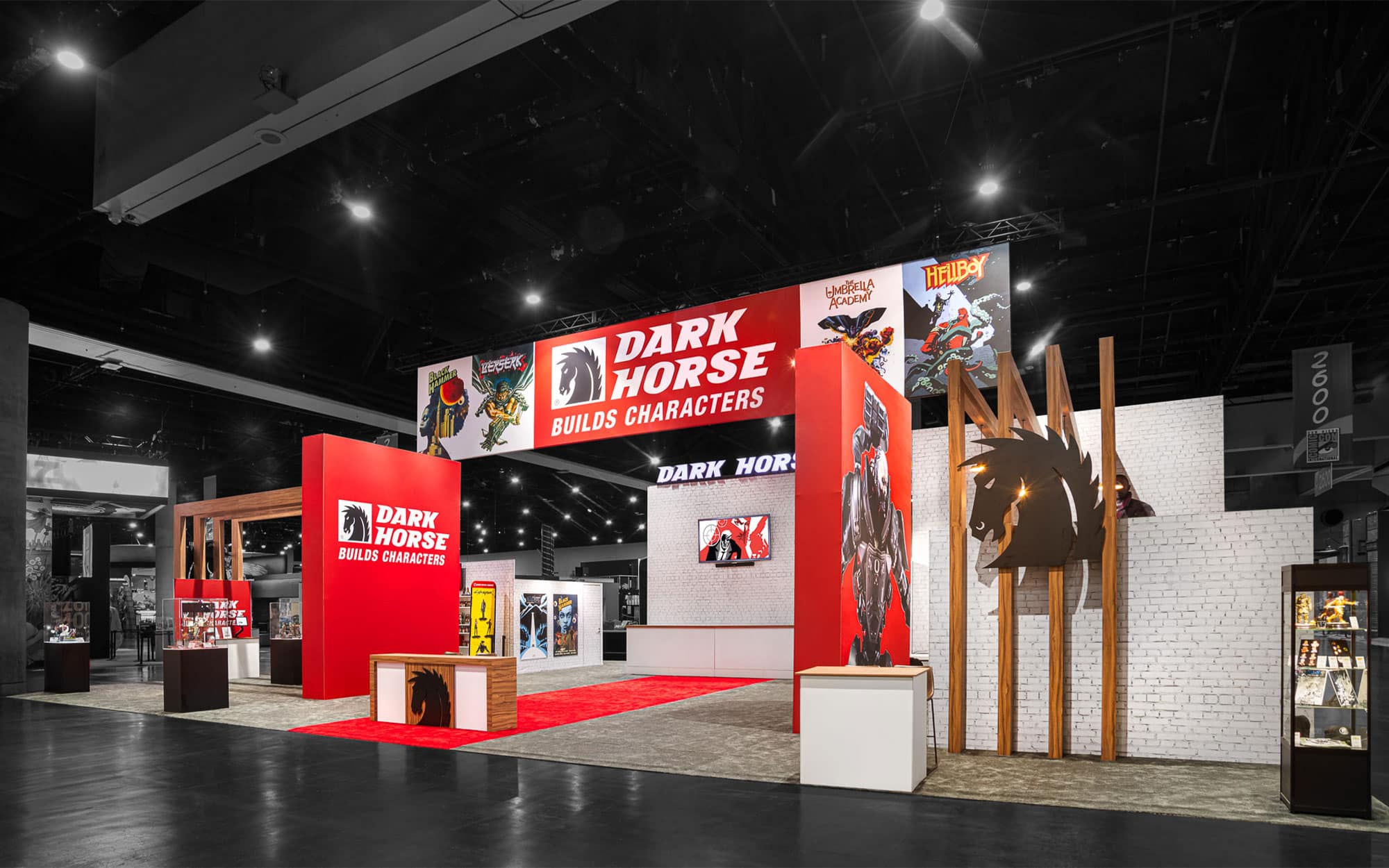 Custom exhibition booth design with bold branding, display showcases, and immersive visual elements