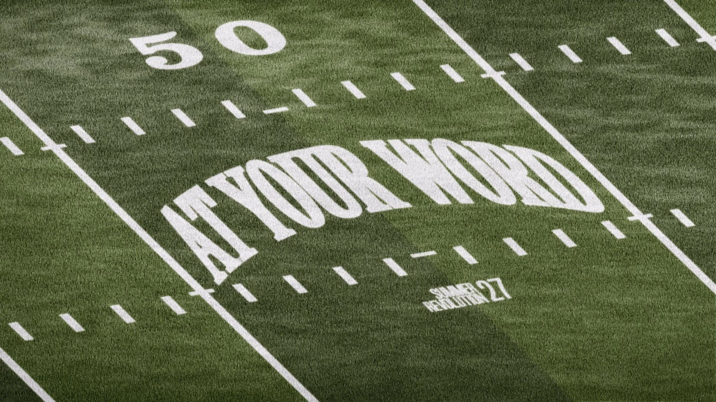 An American football field marked with the words At Your Word
