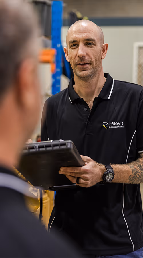 Rileys staff with a folder running over a client handover.