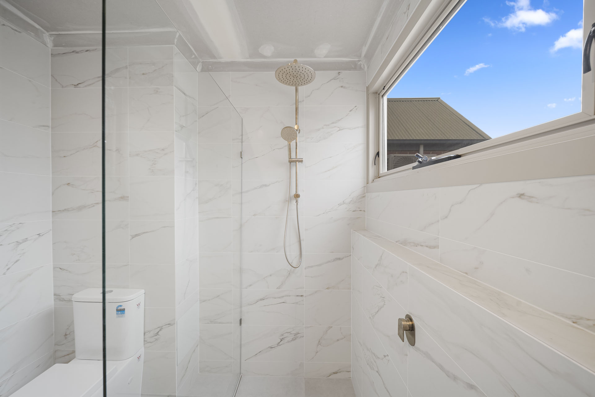 Carrington St, Adelaide, walk-in shower with frameless glass screen and marble-look tiles