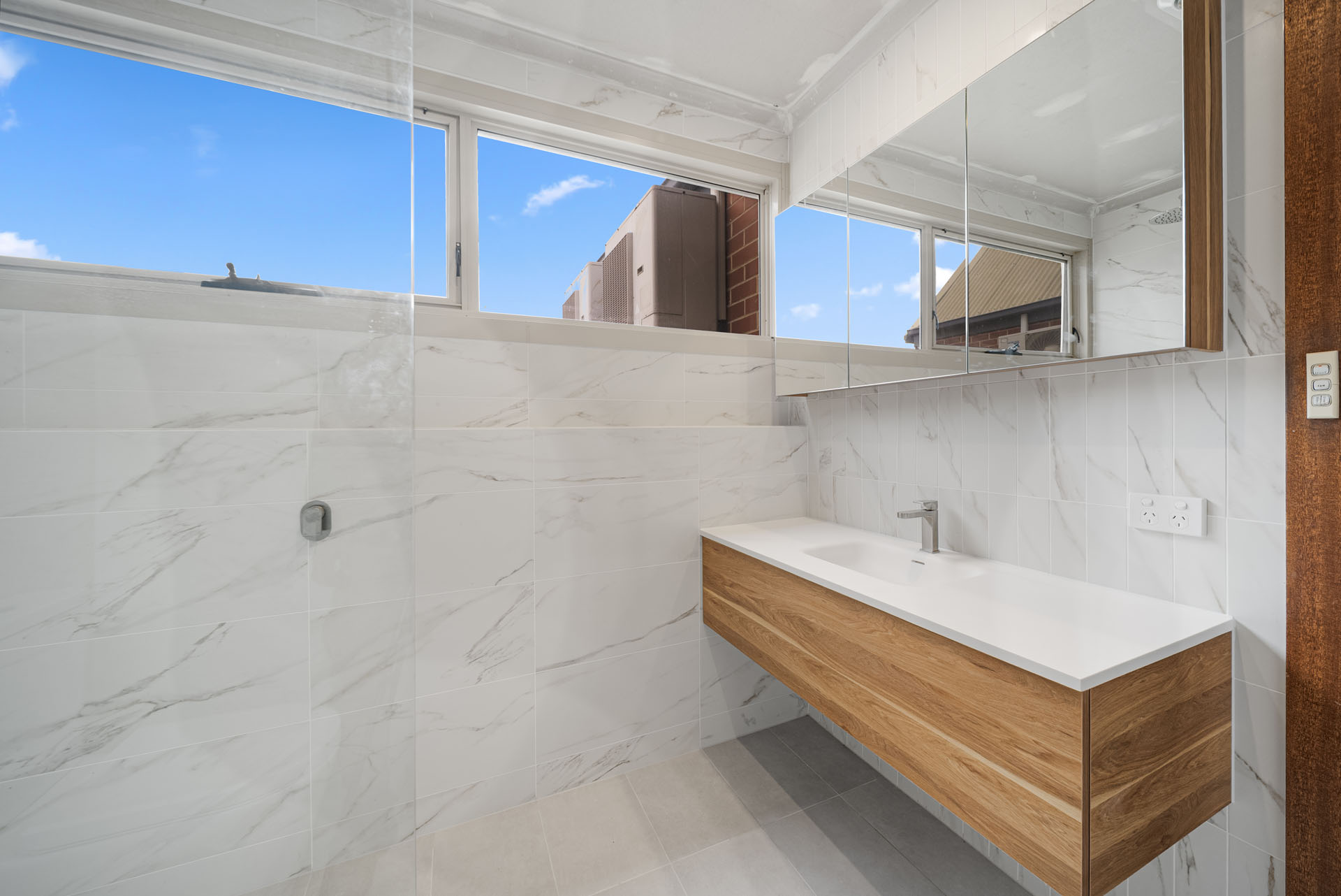 Carrington St, Adelaide, floating timber vanity with marble-look tiles