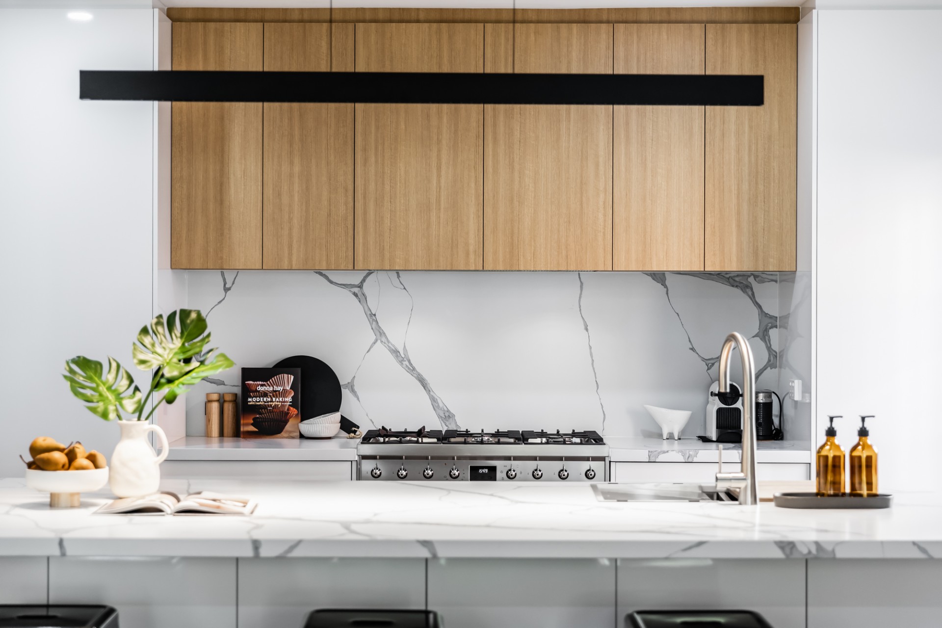 Fisher St, Norwood, kitchen with timber overhead cabinets and marble-look splashback