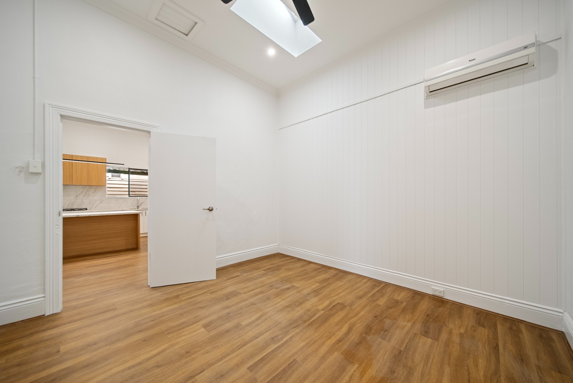 Tap St, Rosewater, living area with skylight and timber floors