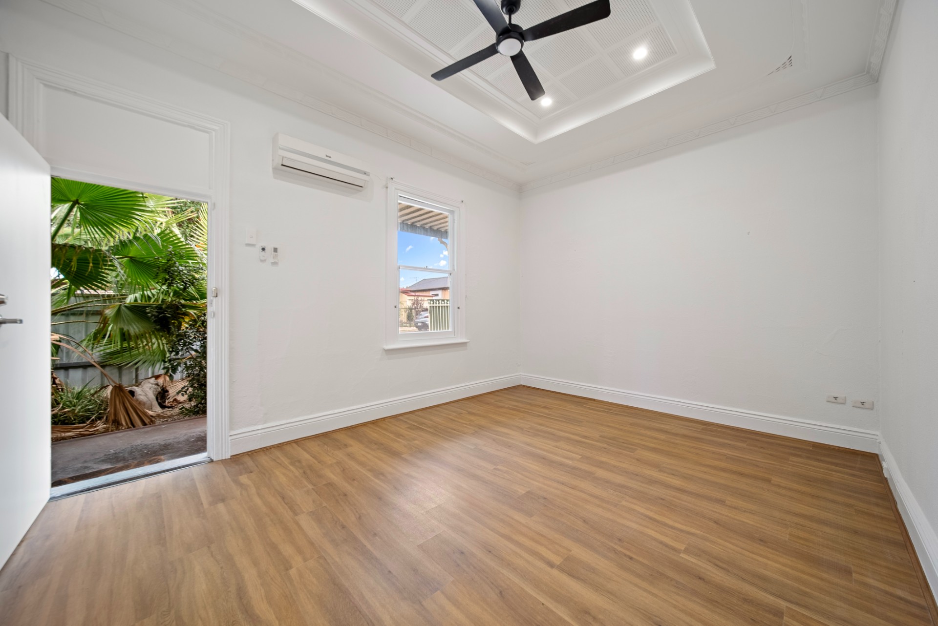 Tap St, Rosewater, light-filled room with timber floors and ceiling fan