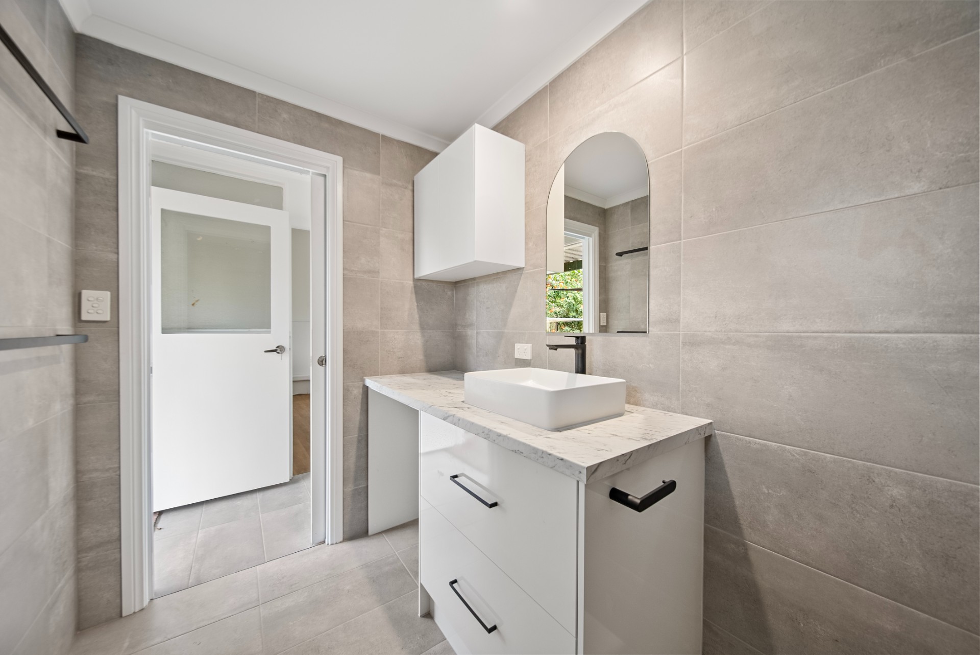 Tap St, Rosewater, bathroom vanity with round mirror and grey tiles