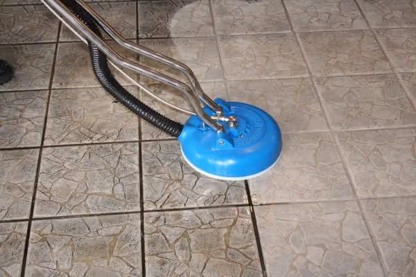 In action before and after of tiles being cleaned. One side is dark and dirty while the other side is clean with no marks