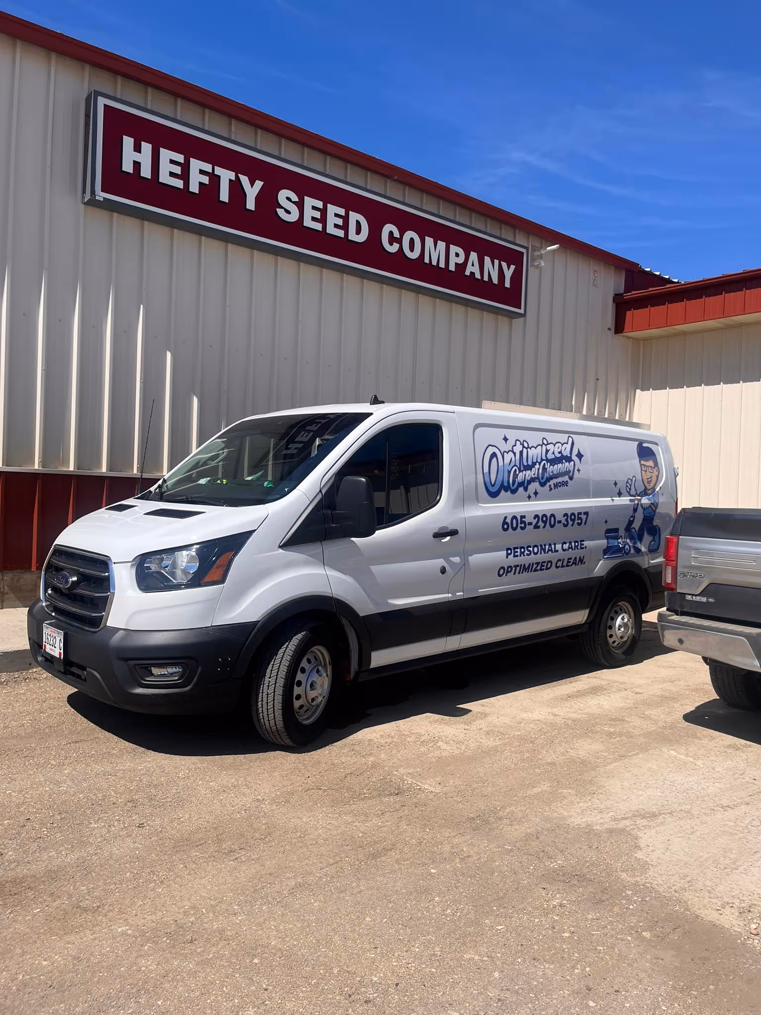 White van with Optimized Cleaning logo on the side