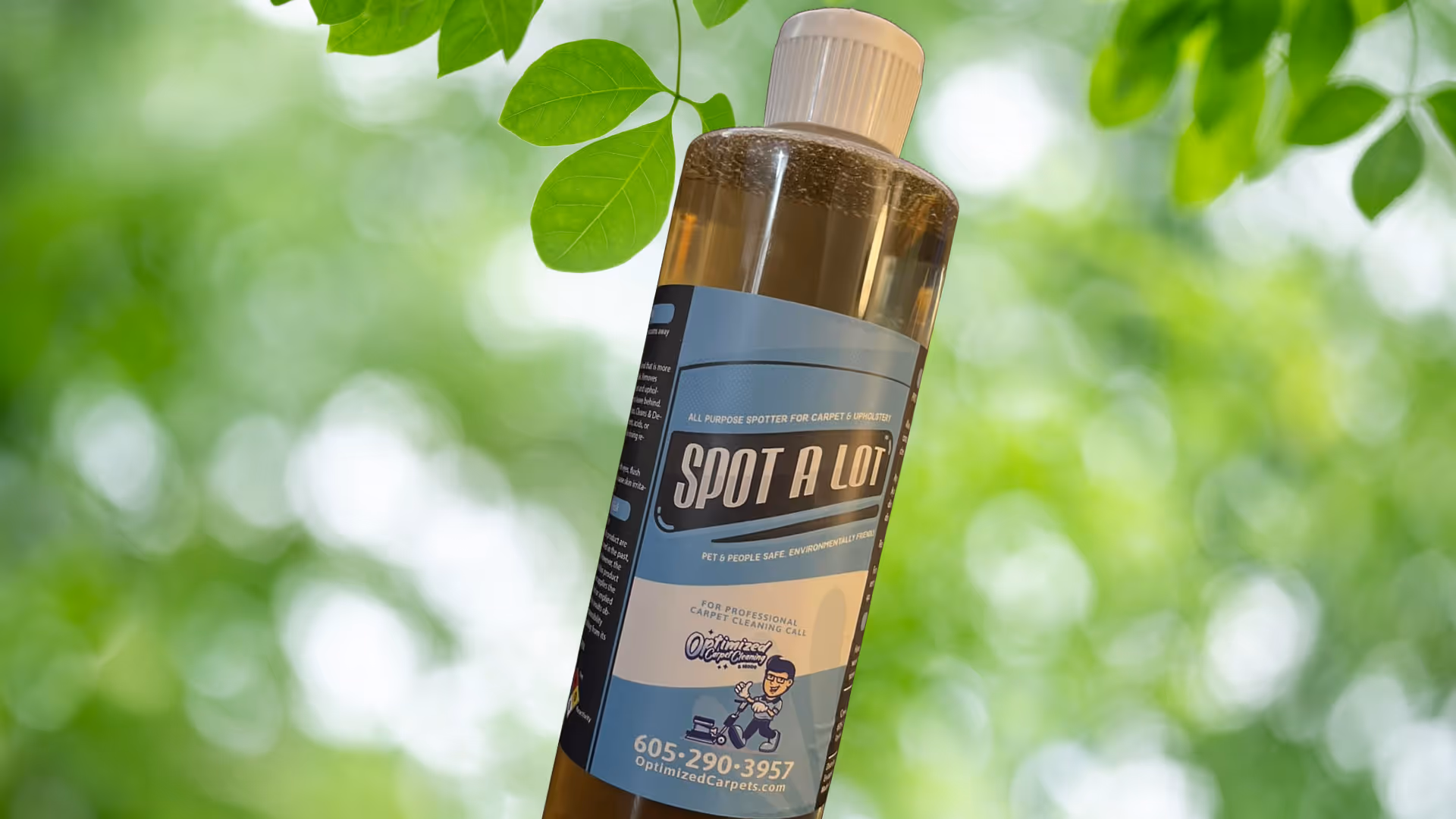 Eco-friendly cleaning solutions in a bottle surrounded by leaves 