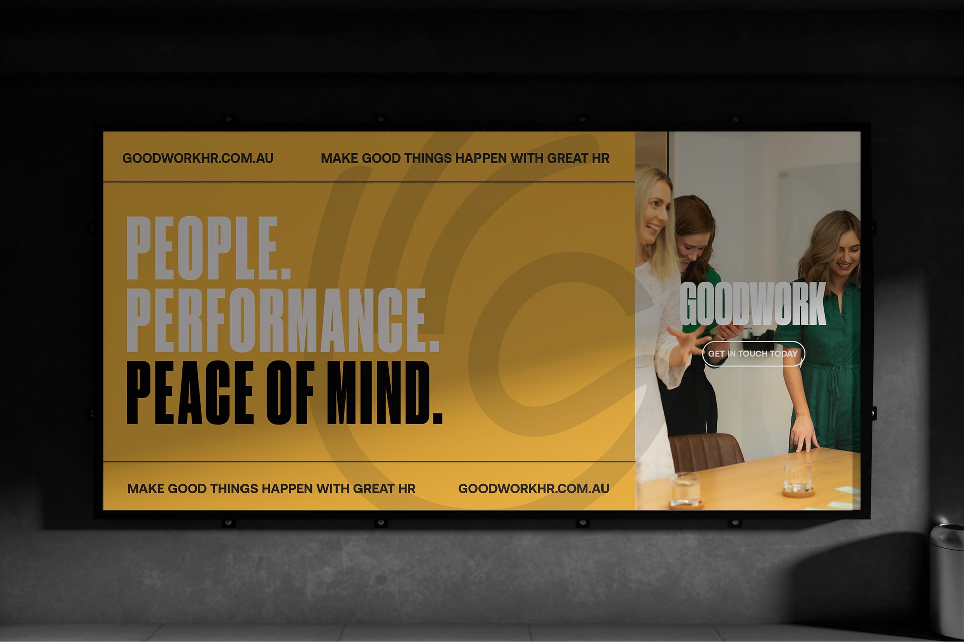 Goodwork HR brand campaign on a large screen reading People. Performance. Peace of mind.