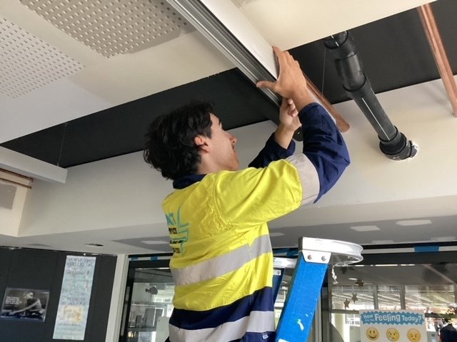 One of Impact's apprentices working on site
