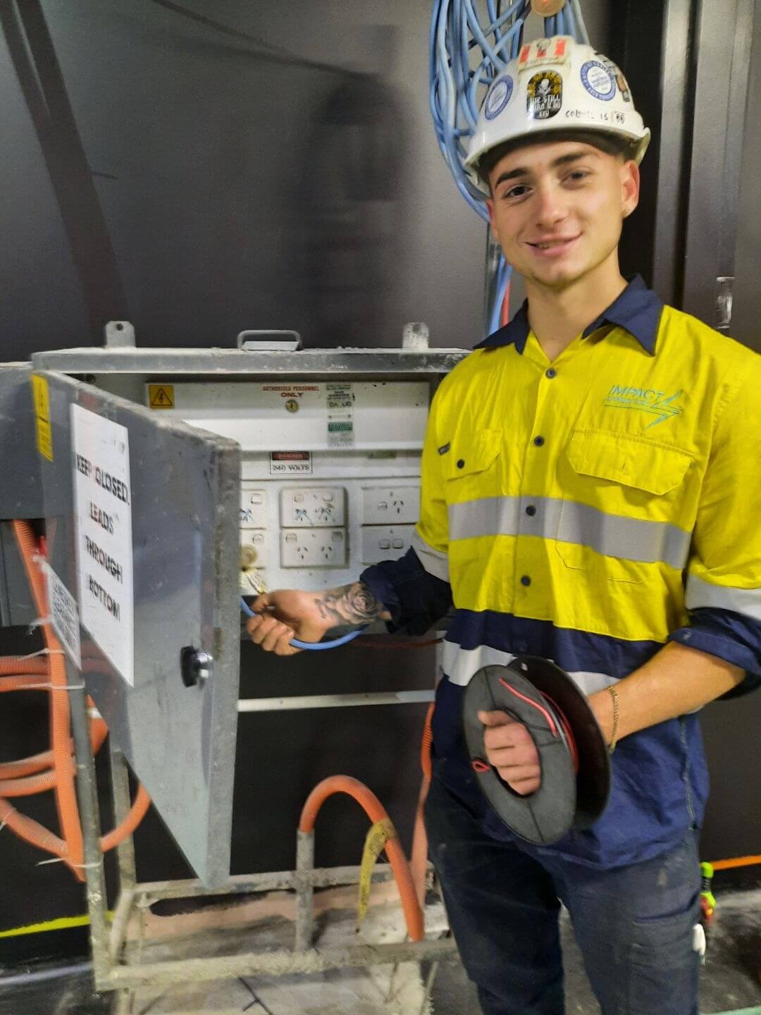 One of Impact's Apprentice wiring at host employer worksite