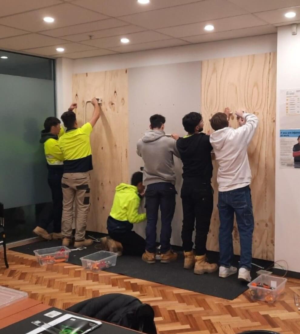 Apprentices working on the circuit board