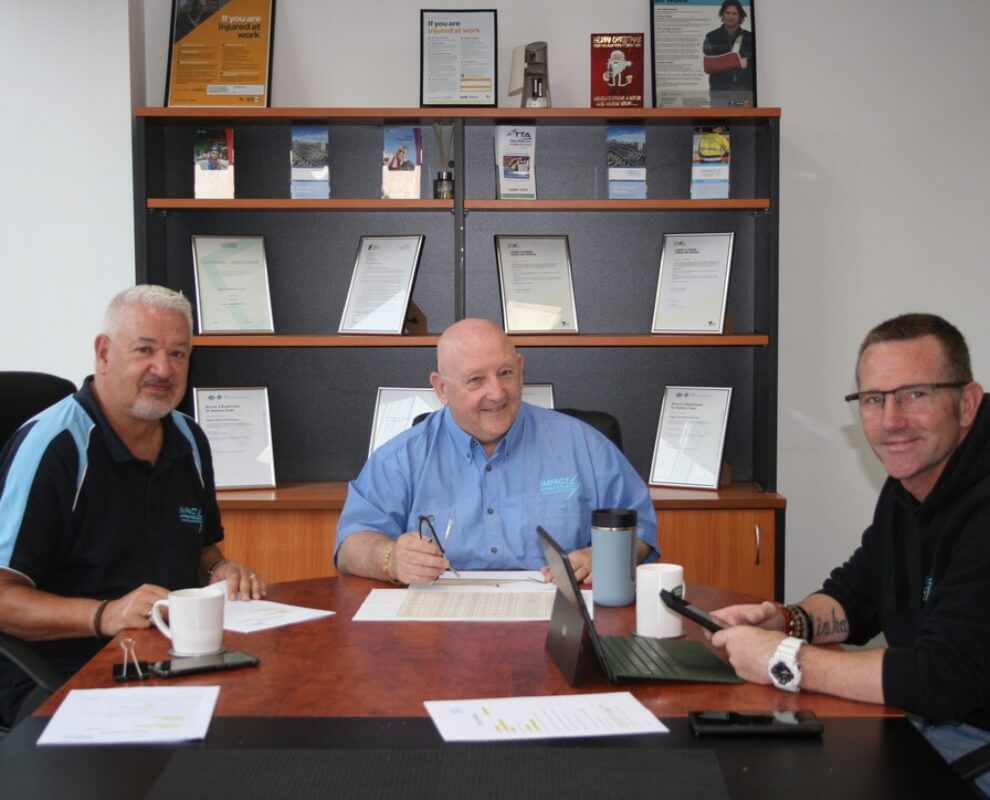 The Impact team of Stephen McKay, Ian Theobald and Ryan McKay in the meeting room of the Collingwood office
