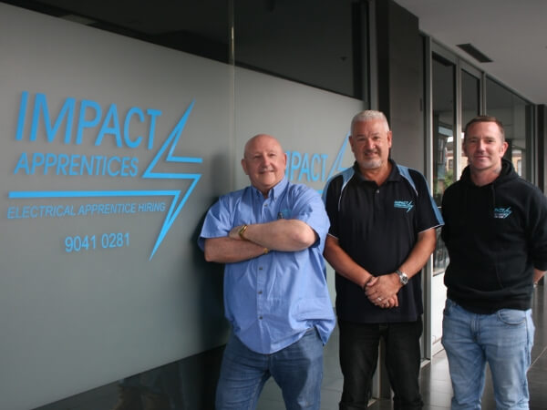 Stephen McKay, Ian Theobald and Ryan McKay standing out the Impact Apprentice office in Collingwood