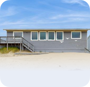 An image of a gray beach house in Bay Shore.