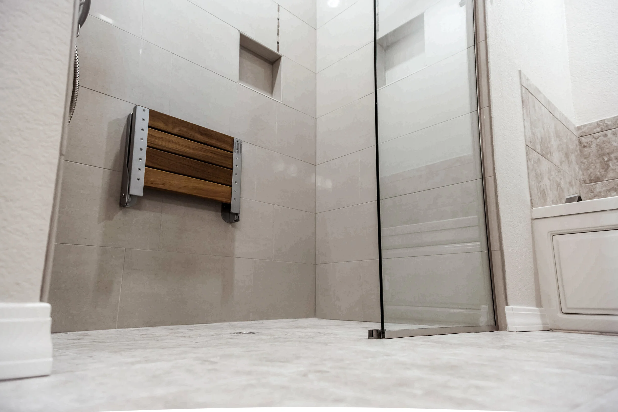 Walk-In Curbless Shower with bench allows for a safer experience.