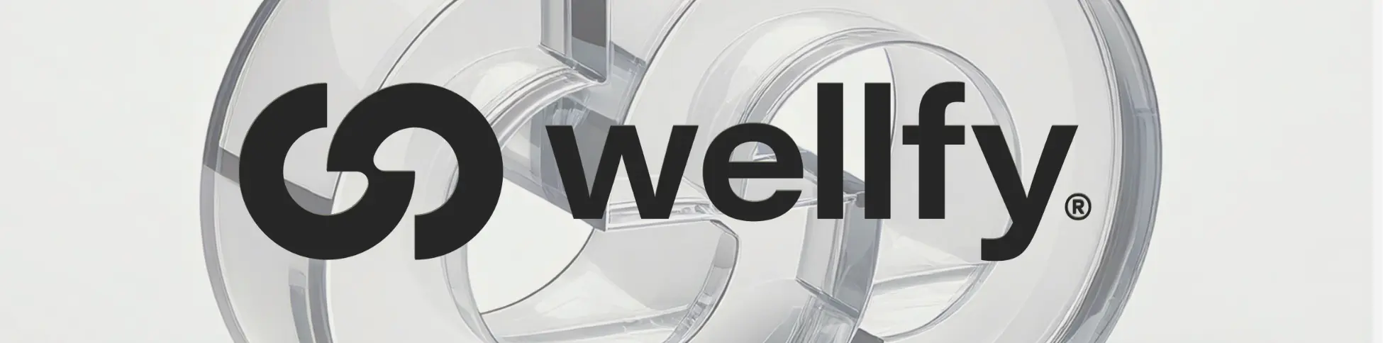 Leuchtendes Wellfy-Logo in grüner Schrift auf einem Tisch – Symbol für zertifizierte Online-Präventionskurse.