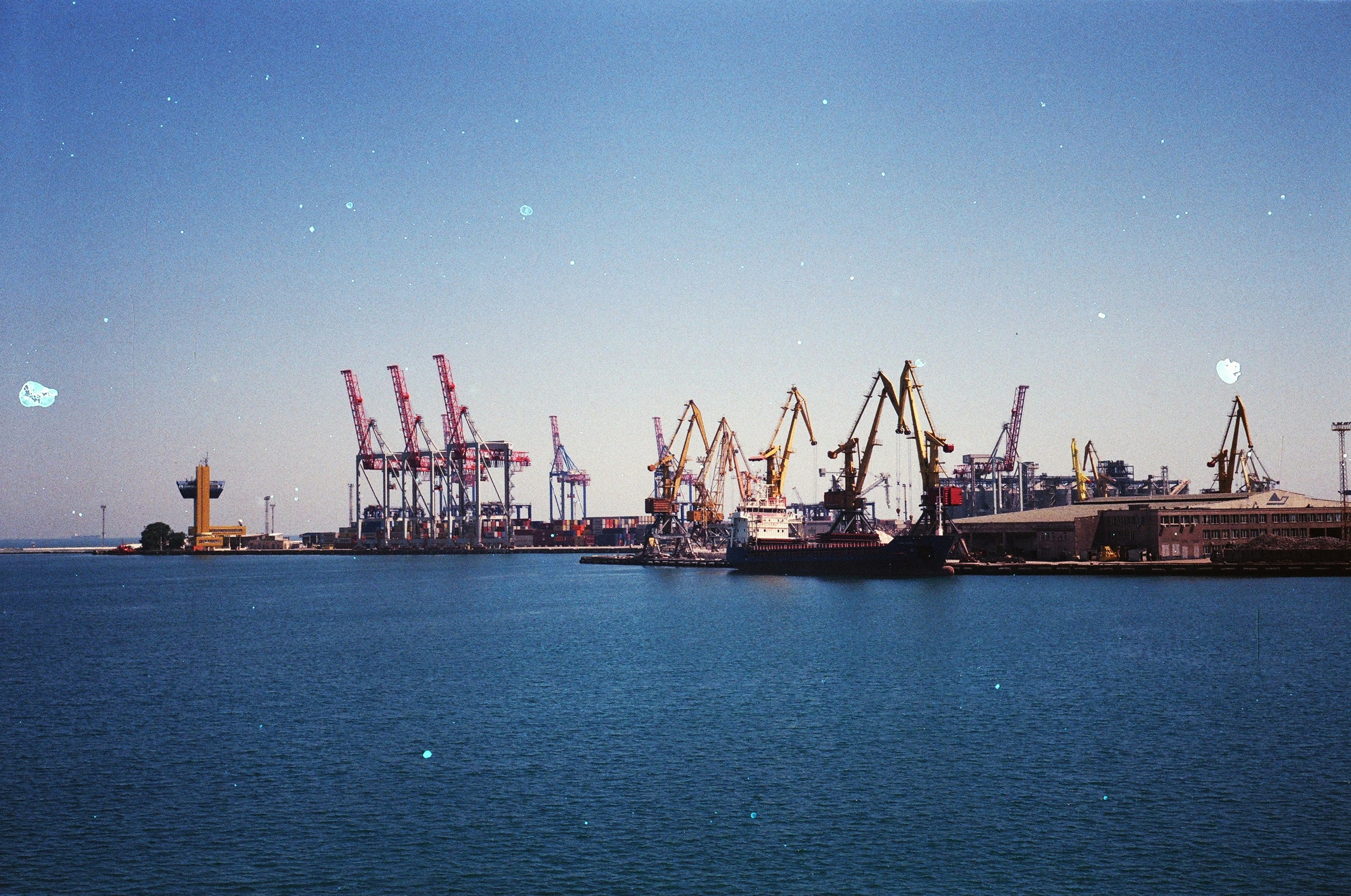 Cranes loading a vessel at berth