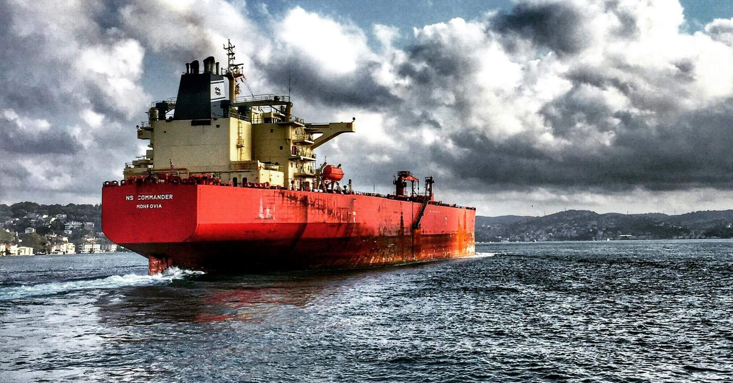 A ship at sea during cloudy weather.