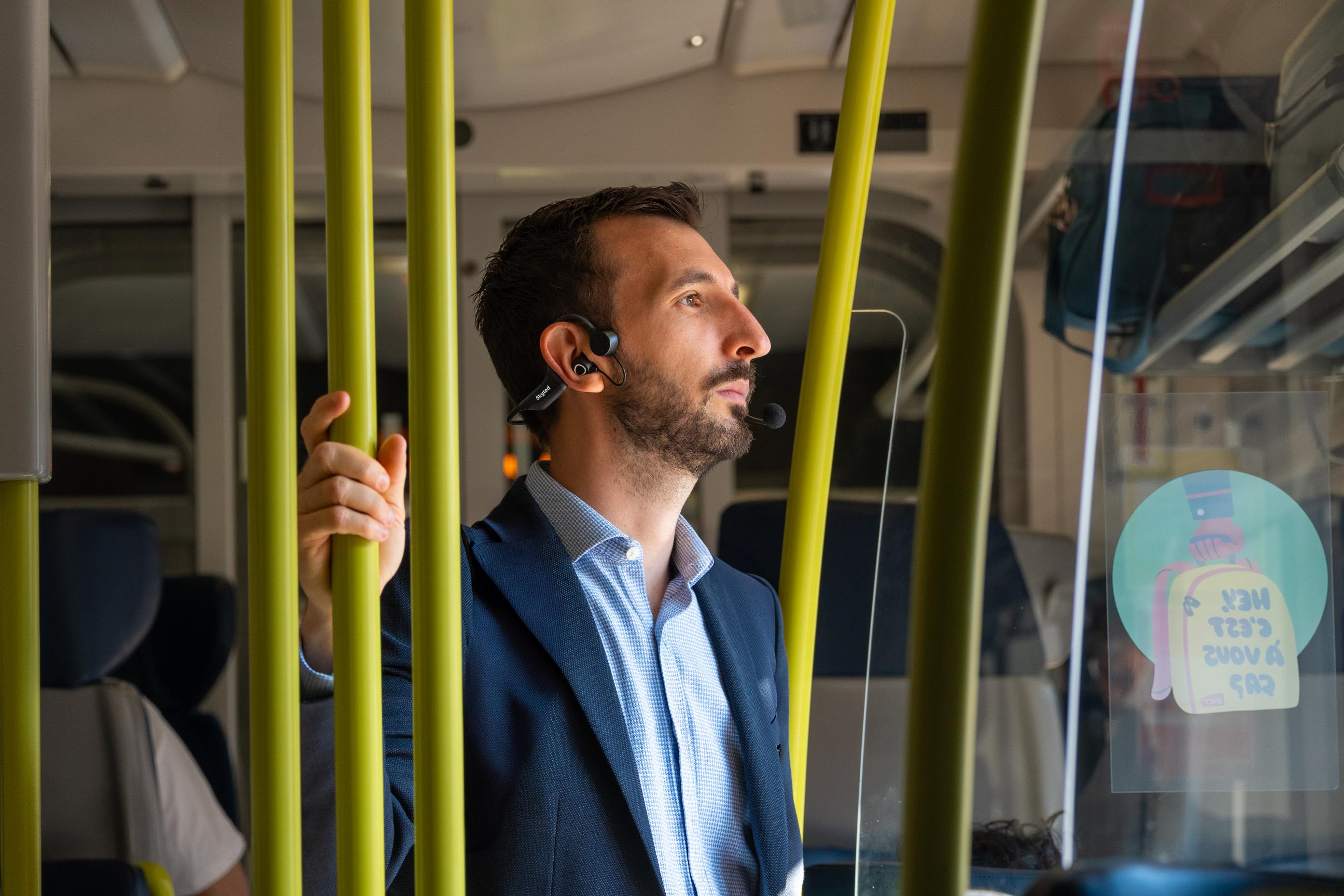 a man using skyted 320 in the metro