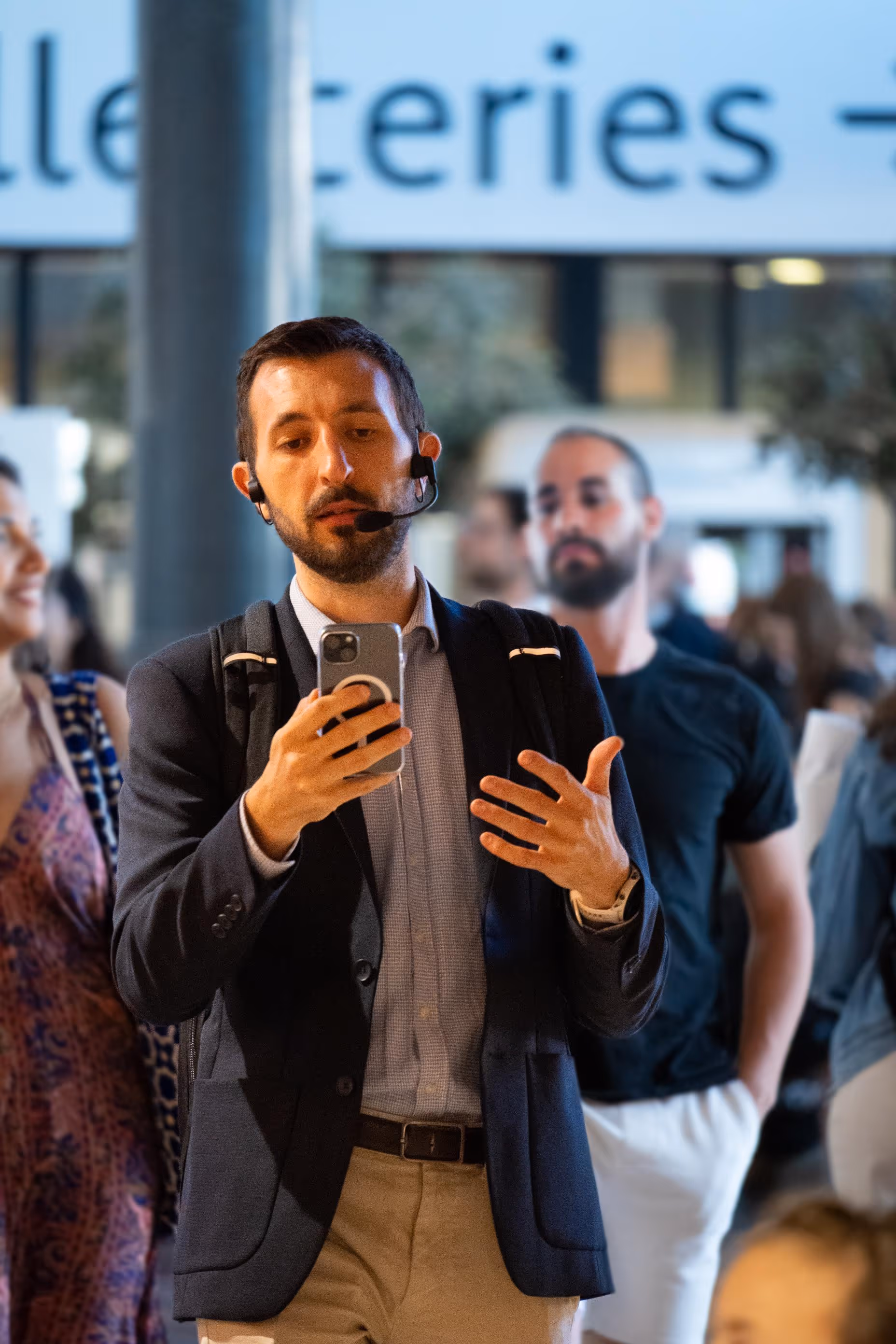 a man talking and using skyted 320 on the street