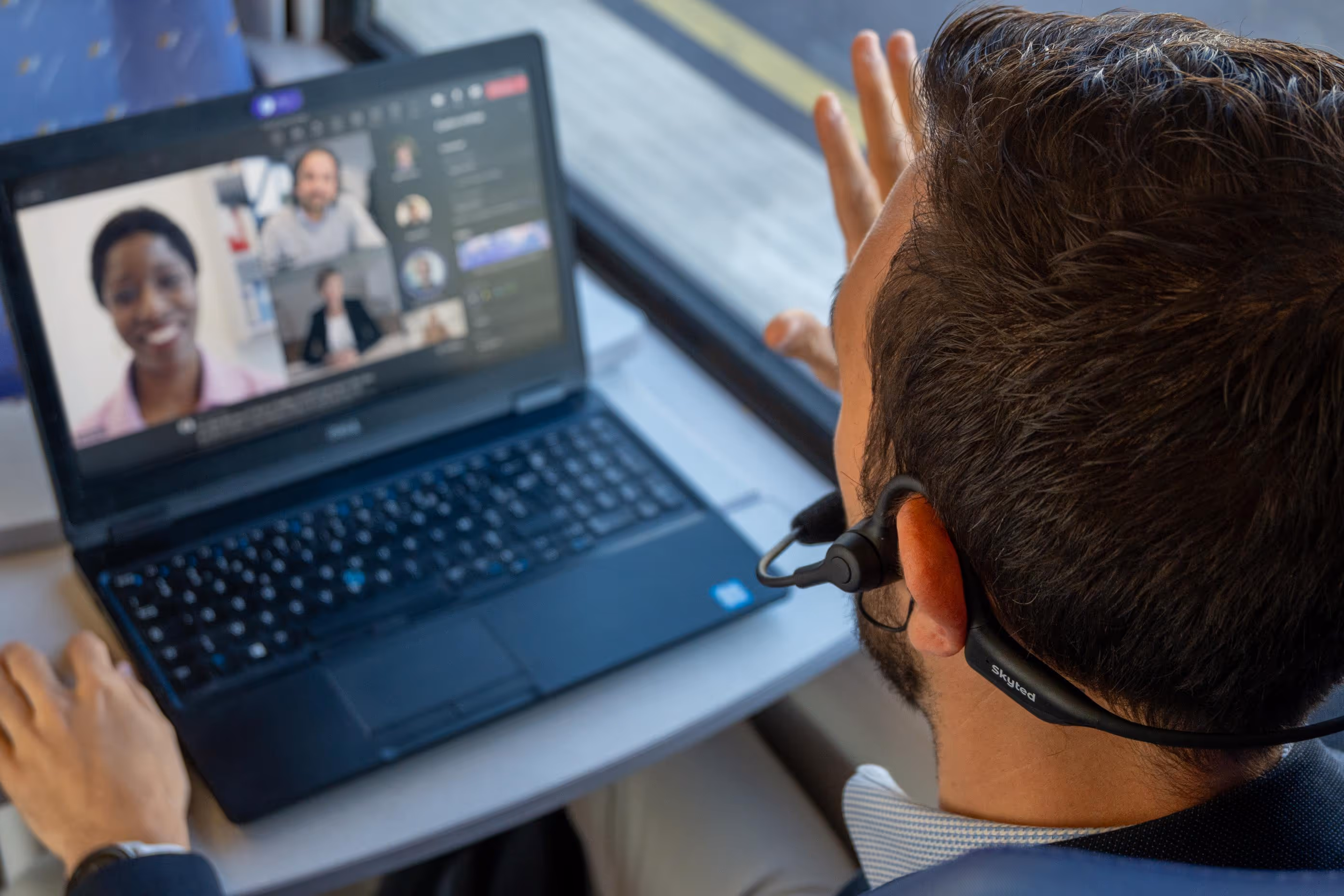 view of a call on a laptop using skyted 320 on the train