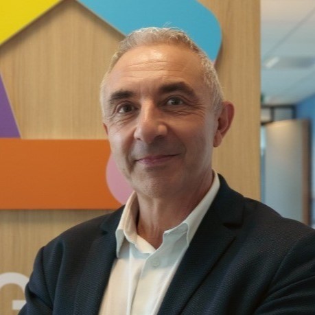 A man working at Orange standing up